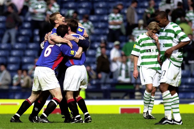 Celtic v Rangers in the Tennent's Scottish Cup Final at Hampden Park in 2002. Final score Celtic 2, Rangers 3. L-R Arthur Numan, Barry Ferguson and Neil McCann celebrate as Johan Mjallby and Didier Agathe look stunned at full time.
