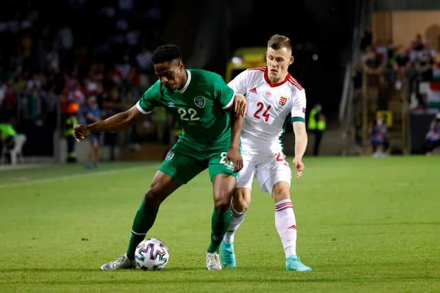 Chiedozie Ogbene of Republic of Ireland is challenged by Szabolcs Schon of Hungary during the international friendly match between Hungary and Republic of Ireland at Szusza Ferenc Stadion on June 08, 2021 in Budapest, Hungary. (Photo by Laszlo Szirtesi/Getty Images)