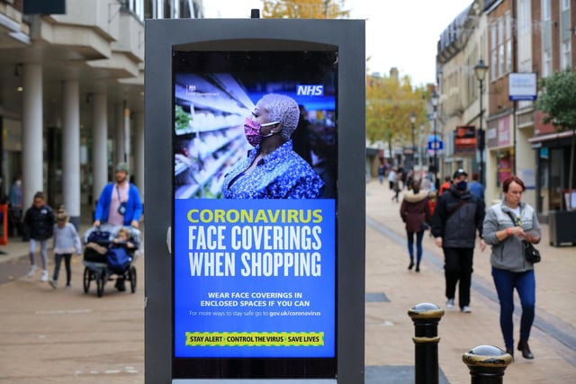 Signs reminding people to wear face masks in the town centre