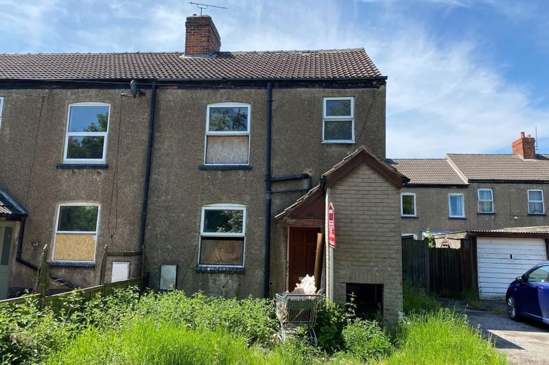 The three-bedroom, end-terrace home stands back behind a foregarden and boasts a reception room and dining kitchen on the ground floor and three bedrooms and a bathroom on the first floor. It is going to auction with a guide price of just £10,000-plus.