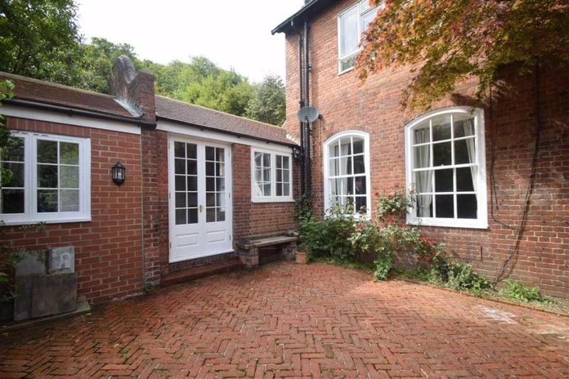 Private, enclosed brick-paved courtyard.