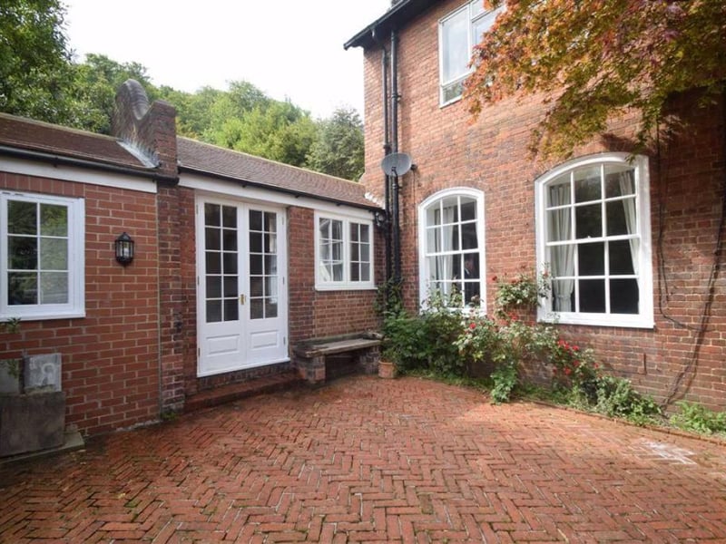 Private, enclosed brick-paved courtyard.