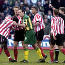 Sheffield United's Patrick Suffo (left) becomes the third player to be sent off by referee Eddie Wolstenholme in the 'Battle of Bramall Lane' - Paul Barker/PA Wire.