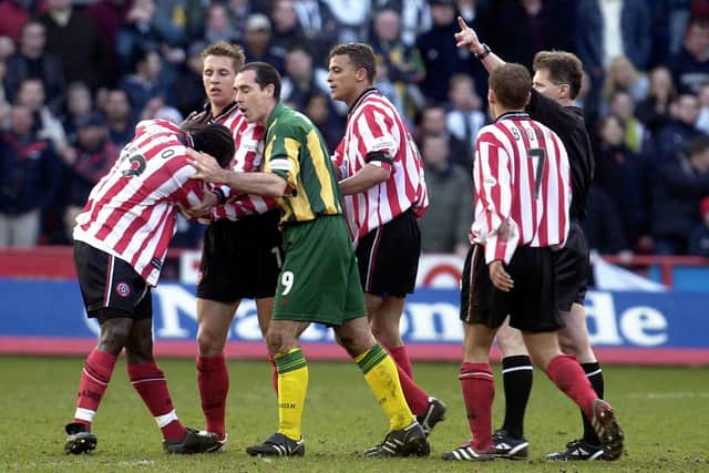 Sheffield United's Patrick Suffo (left) becomes the third player to be sent off by referee Eddie Wolstenholme in the 'Battle of Bramall Lane' - Paul Barker/PA Wire.