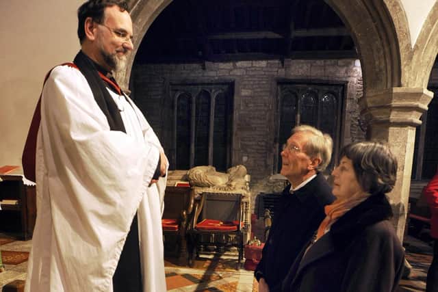 The Reverend Geoffrey White with Katherine and Geoffrey Hartland at St James Church, Norton