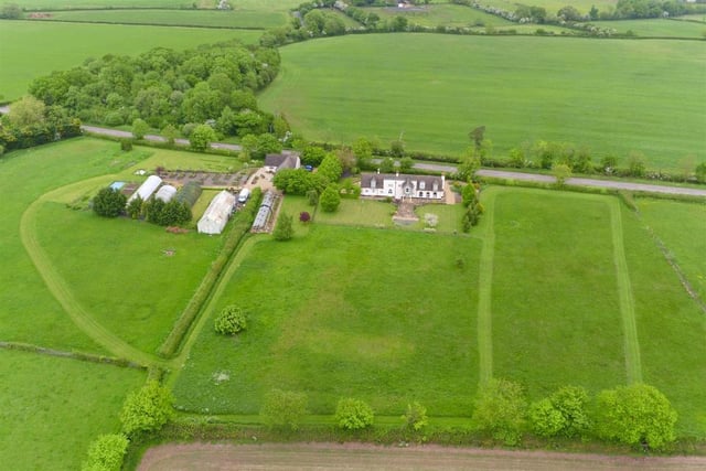 The property is set in 6 and a half acres and features an idyllic, landscaped rear garden which overlooks country fields and beyond.