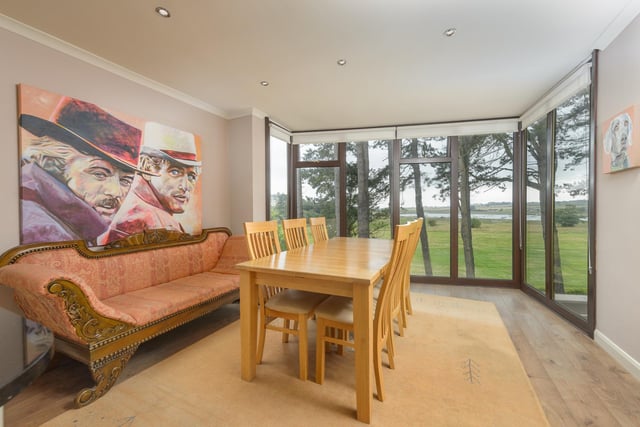 A large dining room with views towards the Aln estuary.