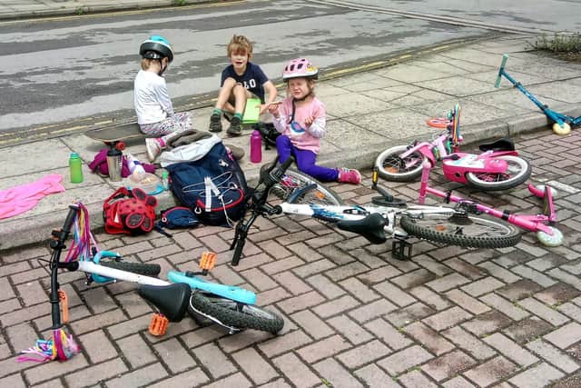 Children having a picnic after cycling