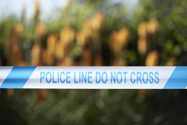 A cordon of police tape (Photo credit should read NIKLAS HALLE'N/AFP via Getty Images)