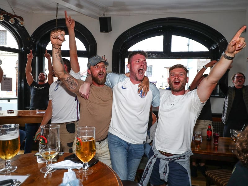 Fans pictured in The Kings pub celebrating on the final whistle. Picture: Stuart Martin (220421-7042)