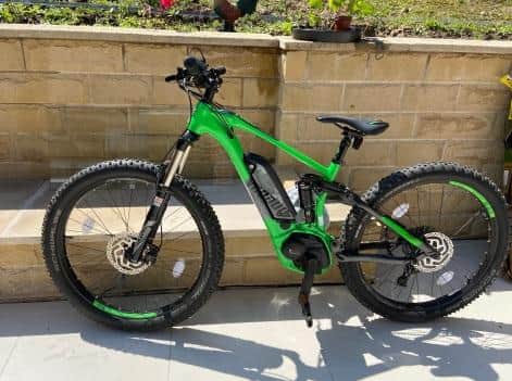The stolen bike is an electric Voodoo Zobop E bike in bright green and black.