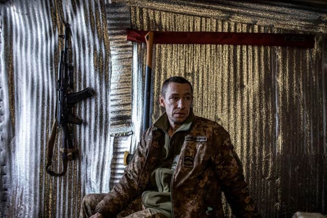 SVITLODARSK, UKRAINE - FEBRUARY 13: Prívate Pablo, 41, sits in an underground barrack at the position of his unit at the contact line near Svitlodarsk, in Donestsk region on February 13, 2022 in Svitlodarsk, Ukraine. Russian forces are conducting large-scale military exercises in Belarus, across Ukraine's northern border, amid a tense diplomatic standoff between Russia and Ukraine's Western allies. Ukraine has warned that it is virtually encircled, with Russian troops massed on its northern, eastern and southern borders. The United States and other NATO countries have issued urgent alerts about a potential Russian invasion, hoping to deter Vladimir Putin by exposing his plans, while trying to negotiate a diplomatic solution. (Photo by Manu Brabo/Getty Images)