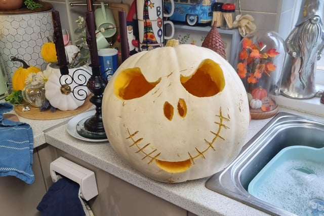 Lindsey Mlynek carved this large white pumpkin with the face of Jack Skellington from The Nightmare Before Christmas.