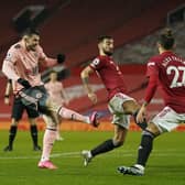 Sheffield United's Oliver Burke scores his side's second goal of the game during the Premier League match against Man Utd at Old Trafford