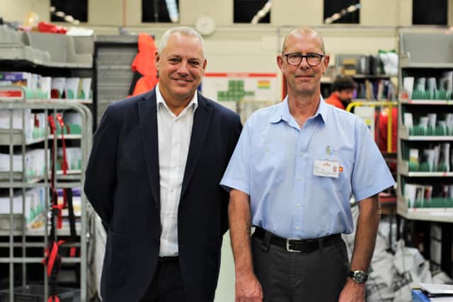 Sheffield postal worker Iain Barker, who 'died' twice on the operating table, with his Royal Mail colleague Mark Wilkinson