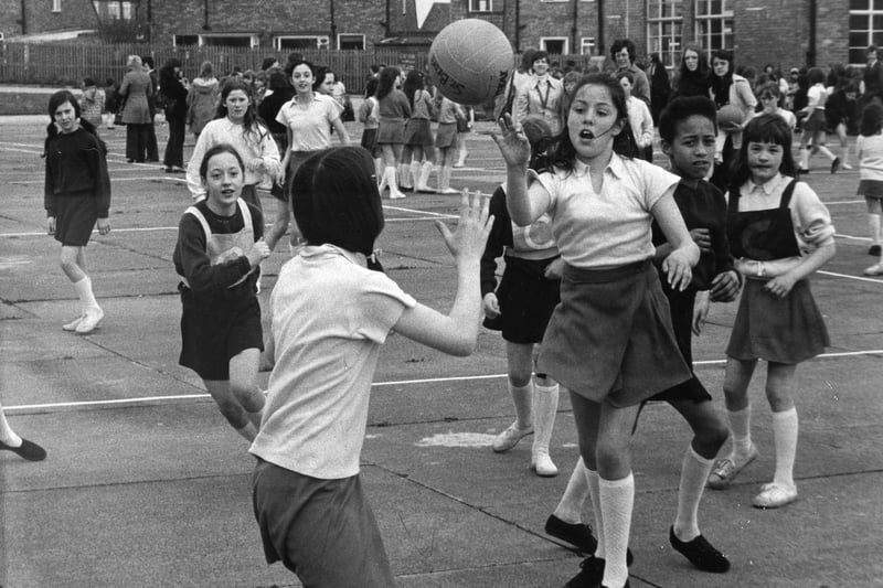 Time for sport in 1975. As the schoolday came to a close, competitive students would show off their skills on the playing field. Here are pupils from Ashley Road and St Bede's John Schools competing at netball.