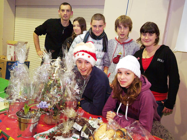 Kirkby lights switch on.
Twinning Association visitors man a festive stall in the Festival Hall.