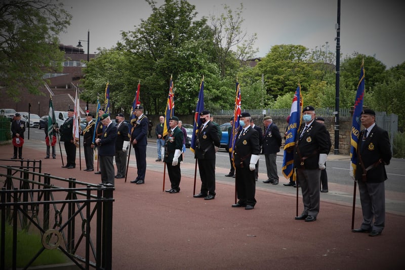 Veterans line up to pay their respects to the fallen at the outdoor D-Day commemoration.