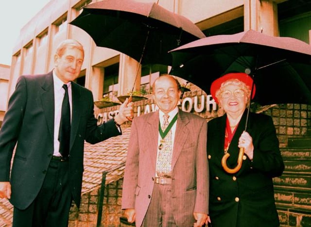 Court Superintent Roy Dawson with Mayor Dorothy Layton and Enoch Layton outside the Magistrates court on a rainy day in 1996.
