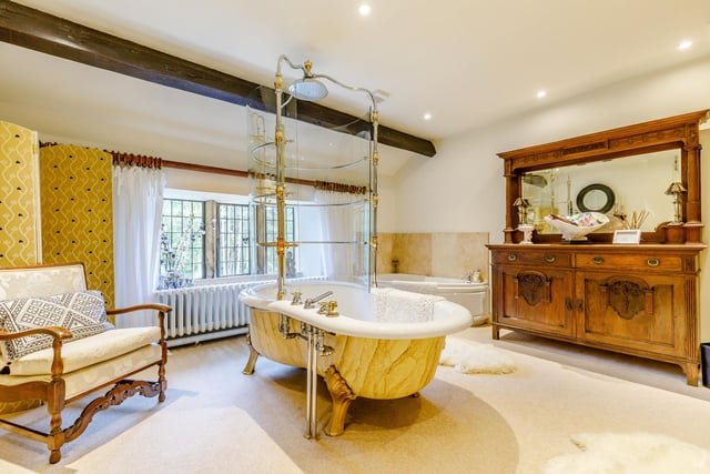 This large bathroom has a show stopping bathtub.