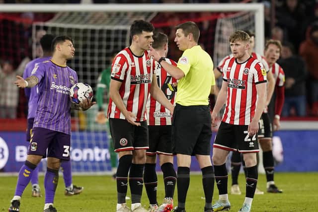 John Egan of Sheffield United receives his marching orders: Andrew Yates / Sportimage