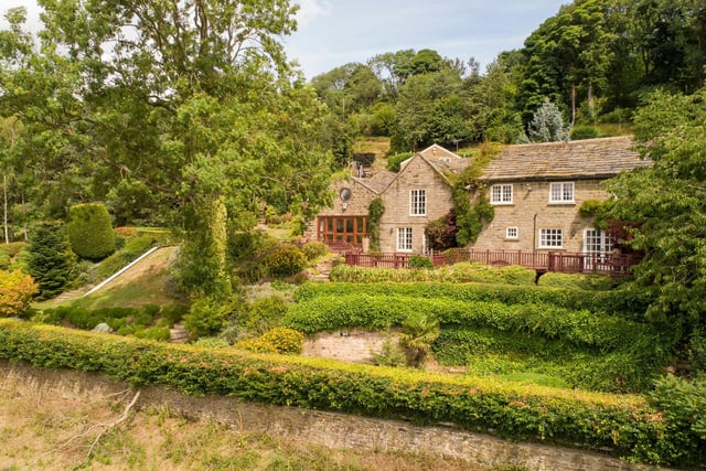 This property's grounds are simply stunning. With vast greenery, great views and a tennis court and a slide, it's really everything you could ask for in a large family garden.