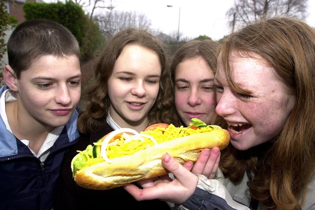 Jennifer Gibson, aged 13, tucked into a veggie sandwich watched by, from left, vegetarian Jonathan Forbes, aged 14, vegan Jessica Handley, also aged 14, and Fern Gibson, aged 13 back in 2002
