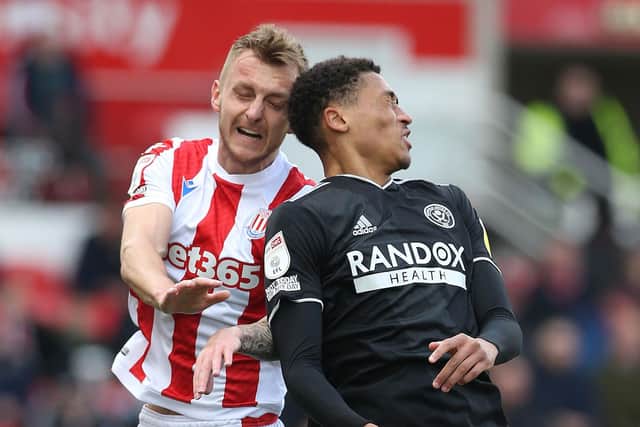 Stoke City's Ben Wilmot and Sheffield United's Daniel Jebbison: Barrington Coombs/PA Wire.
