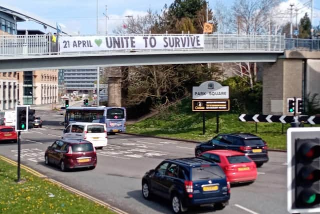 Extinction Rebellion climate activists drop a huge banner over Sheffield Parkway ahead of The Big One on April 21, which the group says will be its largest ever protest. Photo: Steph Howlett