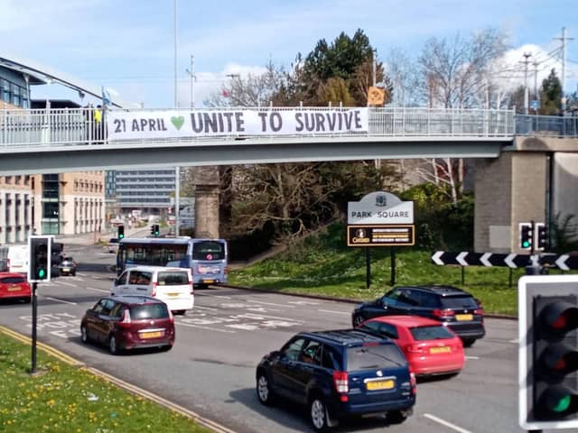 Extinction Rebellion climate activists drop a huge banner over Sheffield Parkway ahead of The Big One on April 21, which the group says will be its largest ever protest. Photo: Steph Howlett