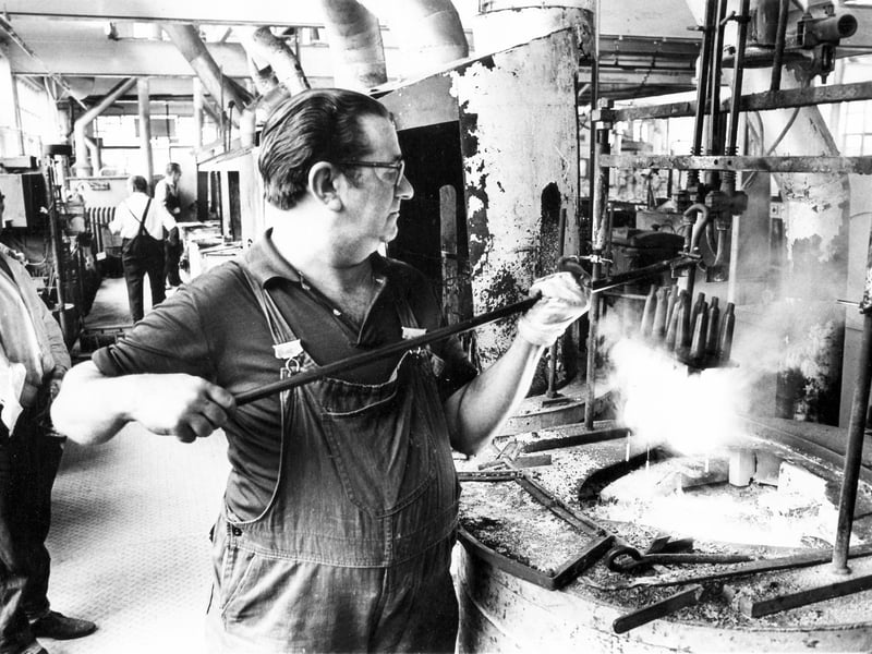 Removing drills from a salt bath during hardening treatment in the heat treatment department of the Sheffield Twist Drill and Steel Company on September 10, 1976