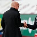 Burnley boss Sean Dyche and SHeffield United manager Chris Wilder shakes hands ahead of their sides' match at Turf Moor  (Photo by CLIVE BRUNSKILL/POOL/AFP via Getty Images)