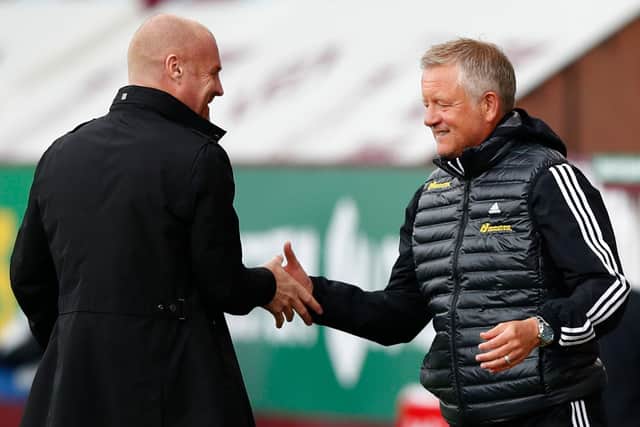 Burnley boss Sean Dyche and SHeffield United manager Chris Wilder shakes hands ahead of their sides' match at Turf Moor  (Photo by CLIVE BRUNSKILL/POOL/AFP via Getty Images)