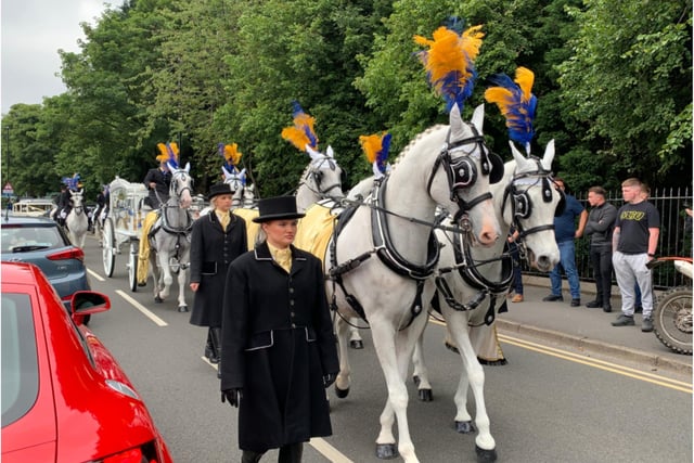 Mr Collins' cortege was led by plumed horses.