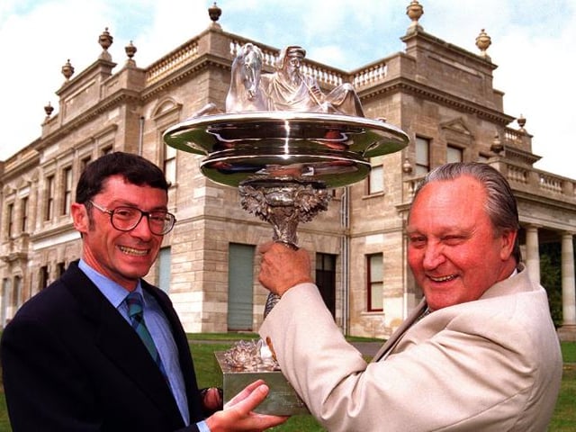 Ronald Williams hands over the Goodwood cup to Peter Gordon Smith in 1996.