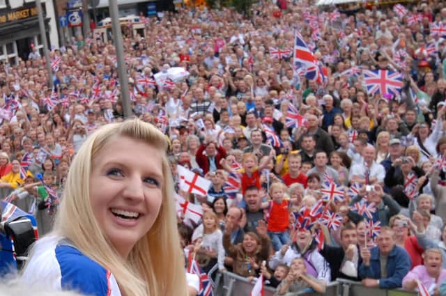 Rebecca posing with thousands of fans