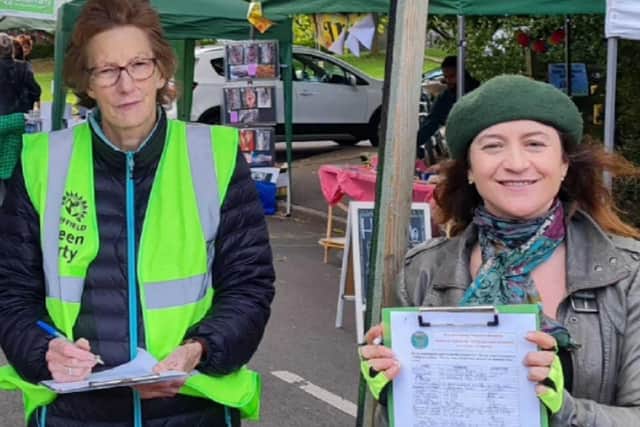 Green Councillor Marieanne Elliot, right, and party campaigner Rachel Hope collecting signatures for their petition to save the 10/10a bus service
