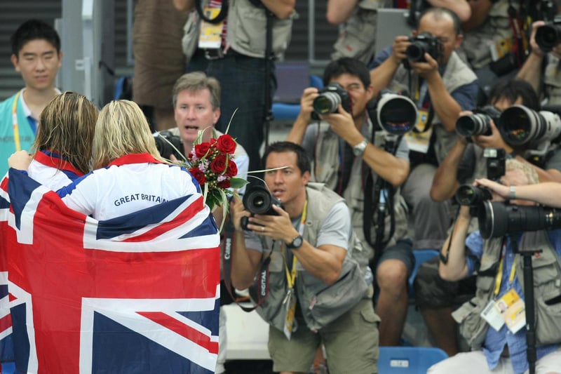 Rebecca Adlington (C-R) celebrates with compatriot Joanne Jackson after the women's 400m freestyle swimming medal ceremony.