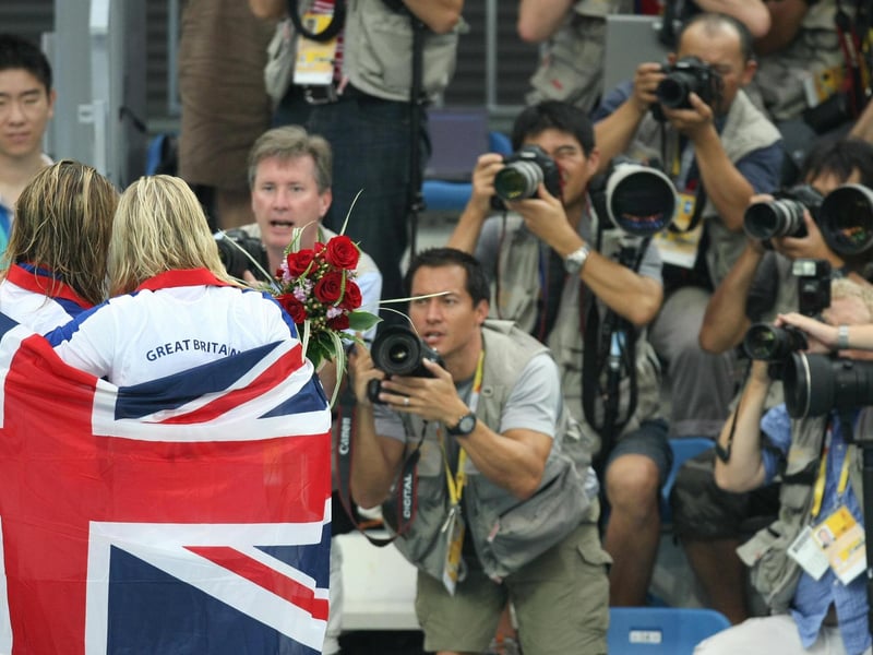 Rebecca Adlington (C-R) celebrates with compatriot Joanne Jackson after the women's 400m freestyle swimming medal ceremony.