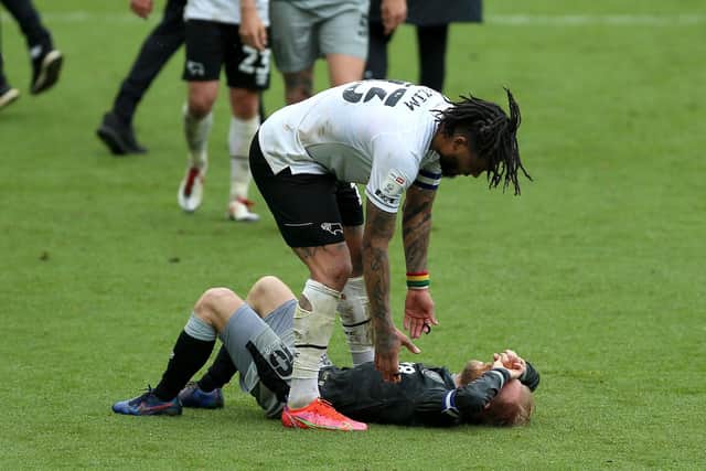 Sheffield Wednesday's Barry Bannan is consoled by Derby County's Colin Kazim-Richards. (Nigel French/PA Wire)
