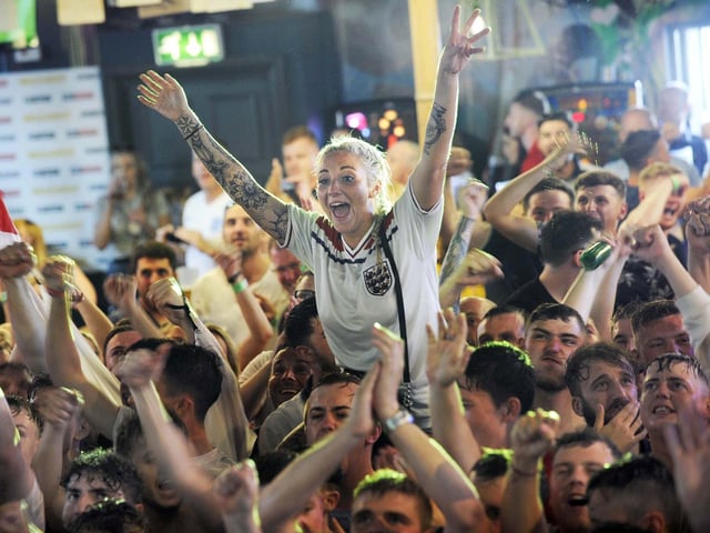 Jubilant England fans in the Walkabout Bar in Sheffield city centre watching the World Cup quarter final win over Sweden, on July 7, 2018