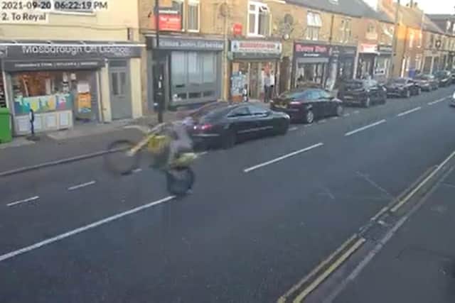 The motorcyclists did a wheelie as they drove up Mosborough High Street.