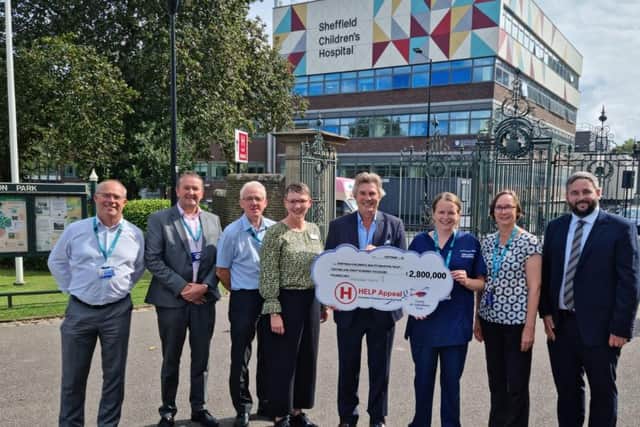 Pictured making a donation towards an appeal for a helipad at Sheffield Children's Hospital are, L-R Stephen Brunyee (Head of Capital Works at Sheffield Children’s NHS Foundation Trust), Peter Knowles (Estates Director at Sheffield Children’s NHS Foundation Trust), Dave Threlfall (Management Lead for Major Trauma at Sheffield Children’s NHS Foundation Trust), Ruth Brown (Chief Executive, Sheffield Children’s NHS Foundation Trust), Robert Bertram, Dr Rachel Tricks, (Clinical Lead for Major Trauma at Sheffield Children’s NHS Foundation Trust), Hannah Keable, Major Trauma and Rehabilitation Coordinator at Sheffield Children’s NHS Foundation Trust), John Armstrong (Chief Executive Officer, The Children’s Hospital Charity).