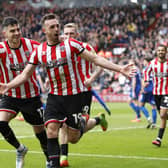 Sheffield United's Jack Robinson (centre) celebrates scoring their side's second goal of the game during the Sky Bet Championship match at Bramall Lane: Richard Sellers/PA Wire.