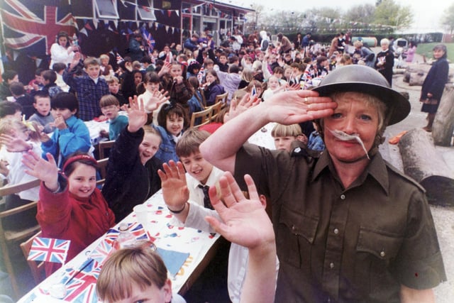 Dinner lady Maureen Monkman with children at the VE Day celebrations at Herdings School, Sheffield in 1995