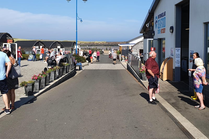 People enjoy a visit to the Amble pods, where a variety of different retail services are provided from food to even a pet store!