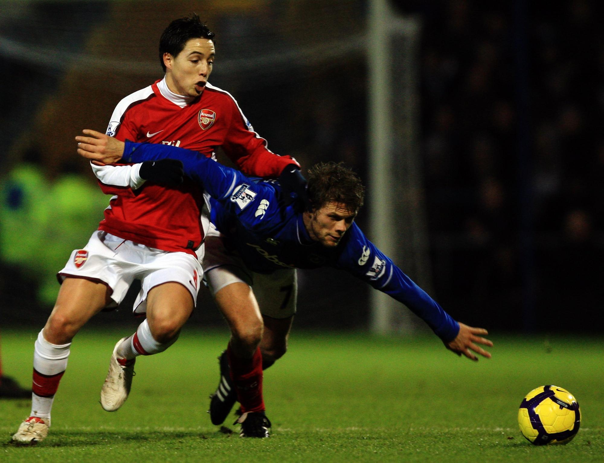 Hermann Hreidarsson challenges Samir Nasri