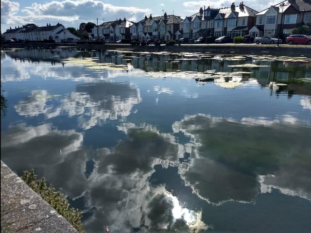 Clouds reflected on Emsworth Mill Pond.