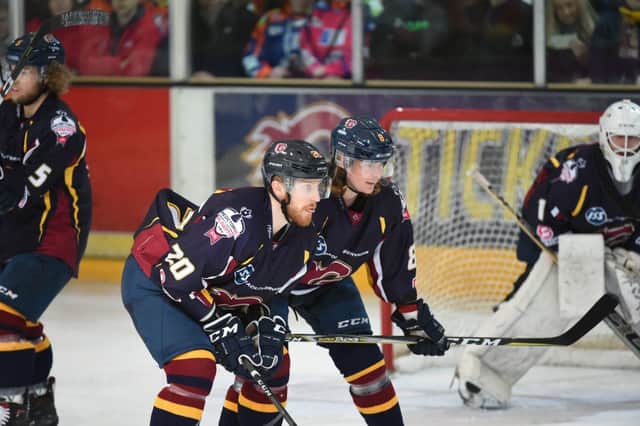 Carl Ackered, right, playing against Steelers in 2017-18.