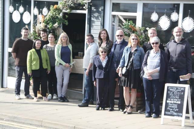 Green councillors and traders celebrate new shops on Middlewood Road.